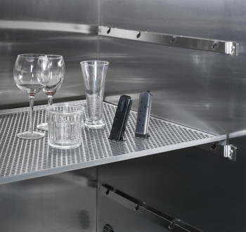 CA fuming glass and metal objects on perforated steel shelves